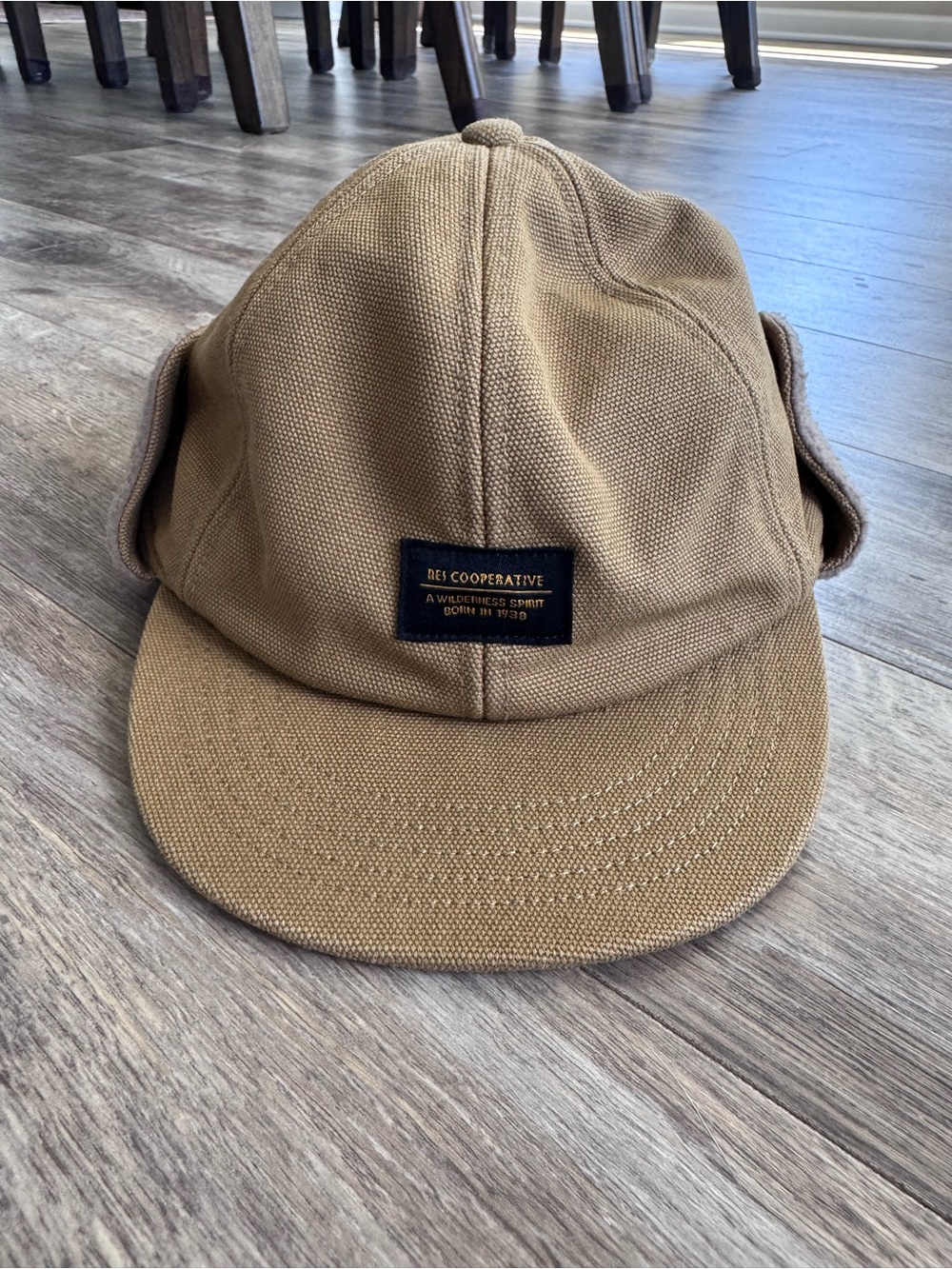 REI Co-op Trailsmith Earflap Hat in the tan colorway